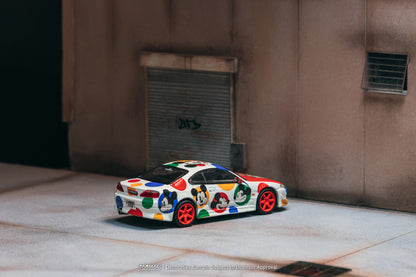 Colorful cartoon-style car parked in front of a building