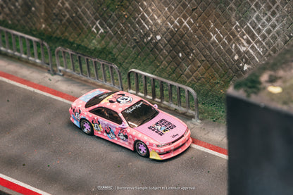 Pink cartoon-themed car on a road with a textured wall in the background