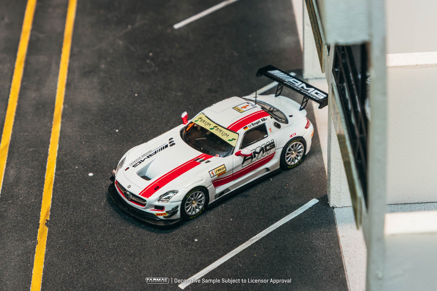 Model car on a track with branding and text overlay