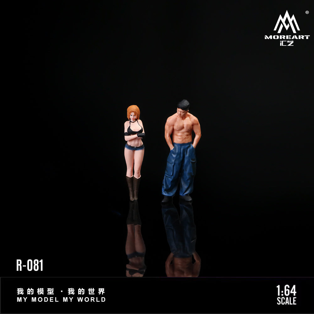 Two action figures of a man and a woman on a black background with 'MOREART CZ' branding.