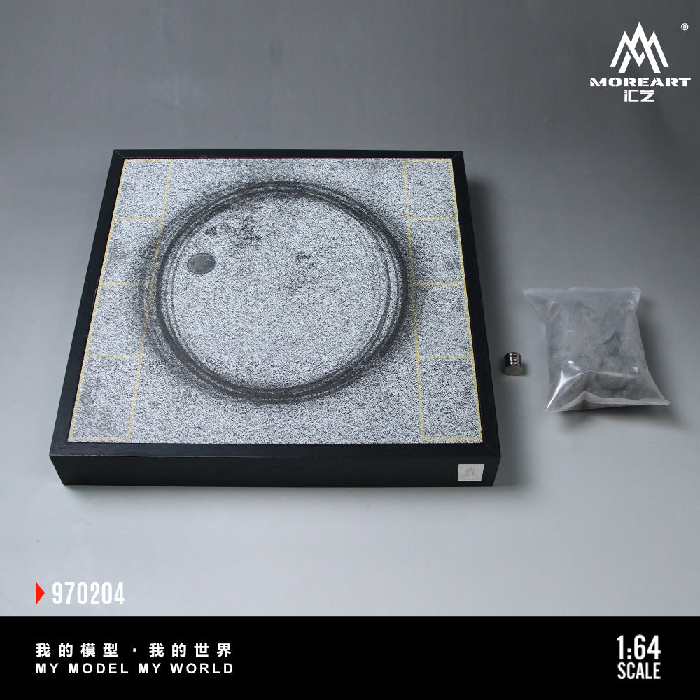 Model of a circular object on a gray surface with 'MOREART' branding.