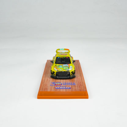 Model car on a wooden display stand with a white background