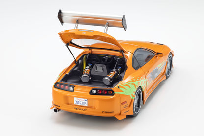 Orange sports car with open trunk on a white background