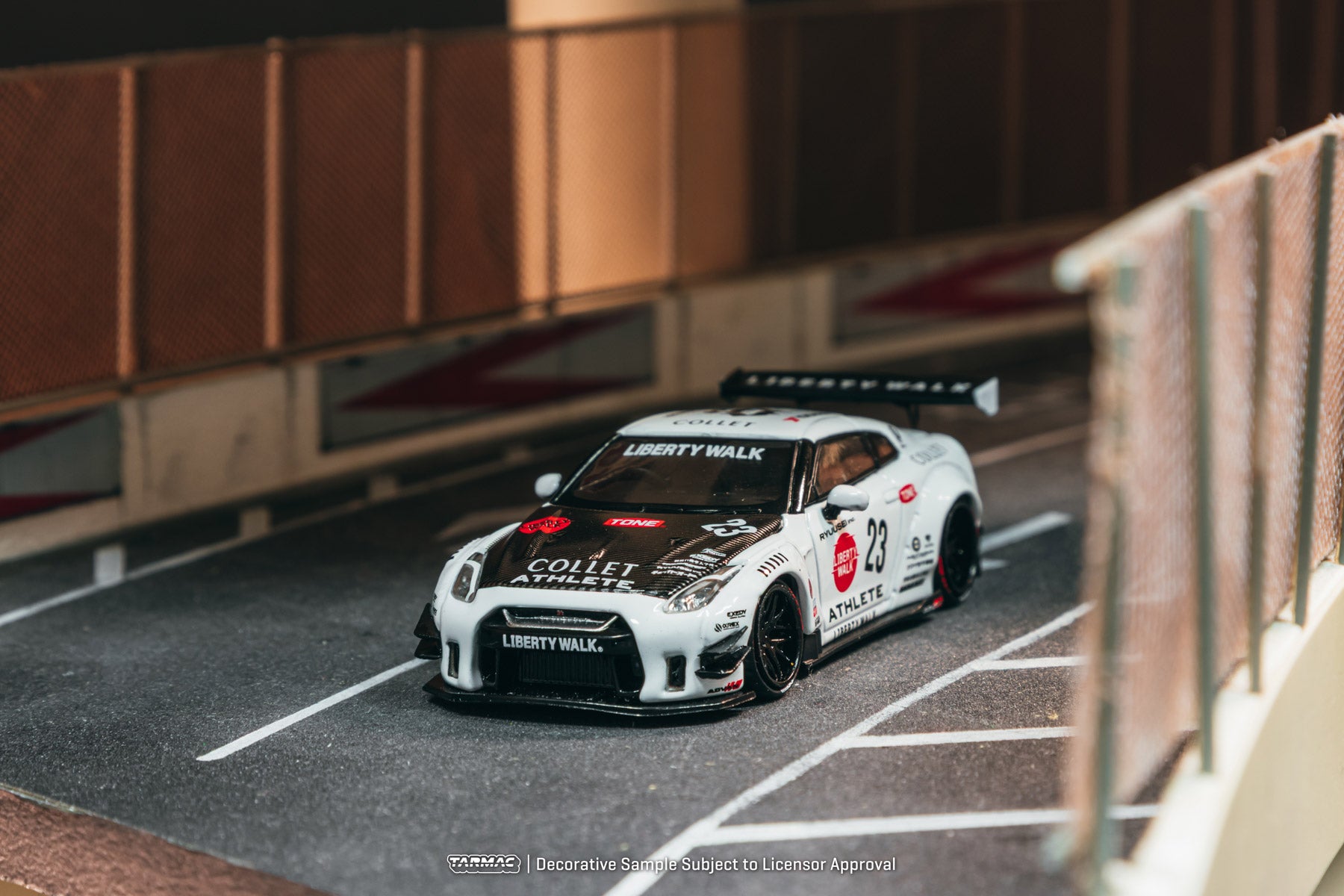 Model car on a track with branding and details