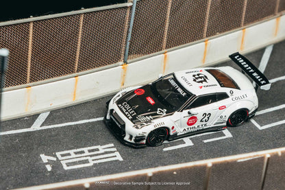 Model race car on a track with branding and numbers