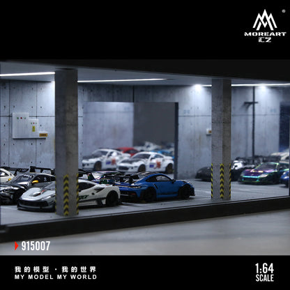 Model cars in a parking garage with 'MoreArt' branding.