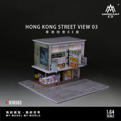 Model of a Hong Kong street scene with various shops on a dark background, featuring the brand 'MOREART'.