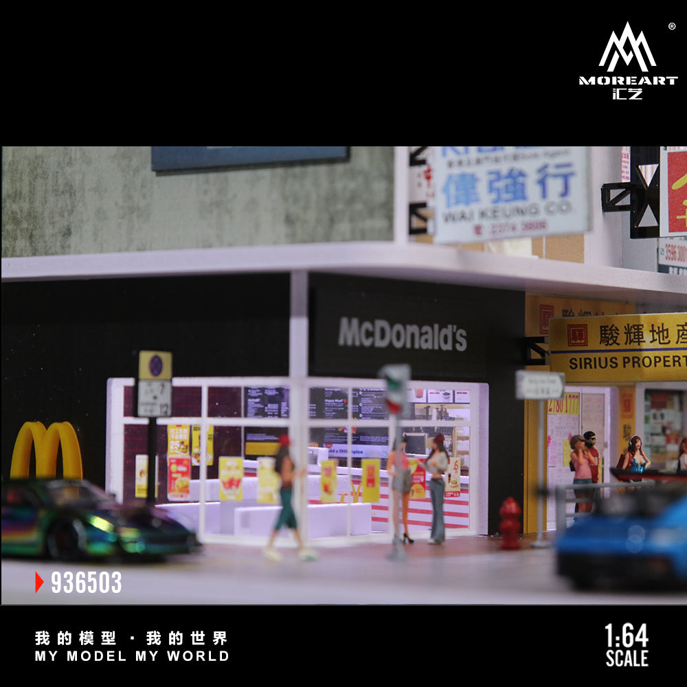 Model of a McDonald's restaurant with people and cars, featuring the Moreart CZ logo.