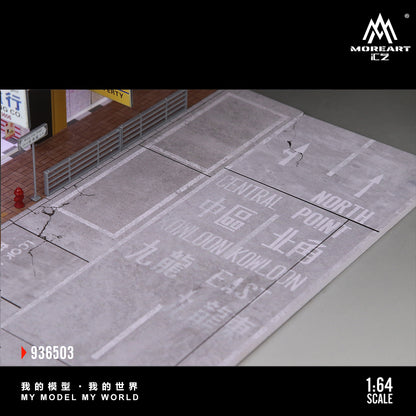 Model street layout with text and signs, featuring MoreArt branding.