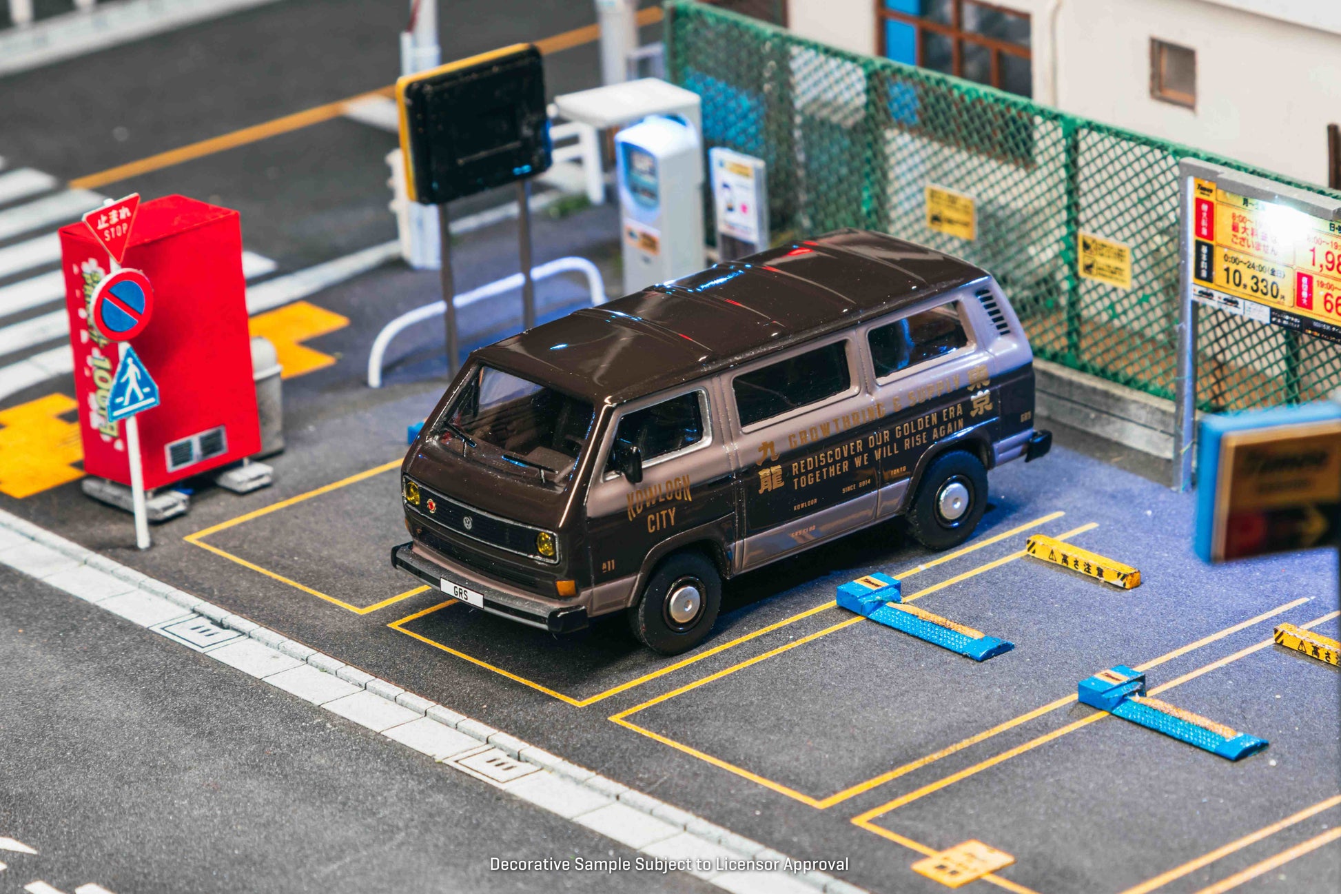 Model van on a miniature road with traffic lights and signs