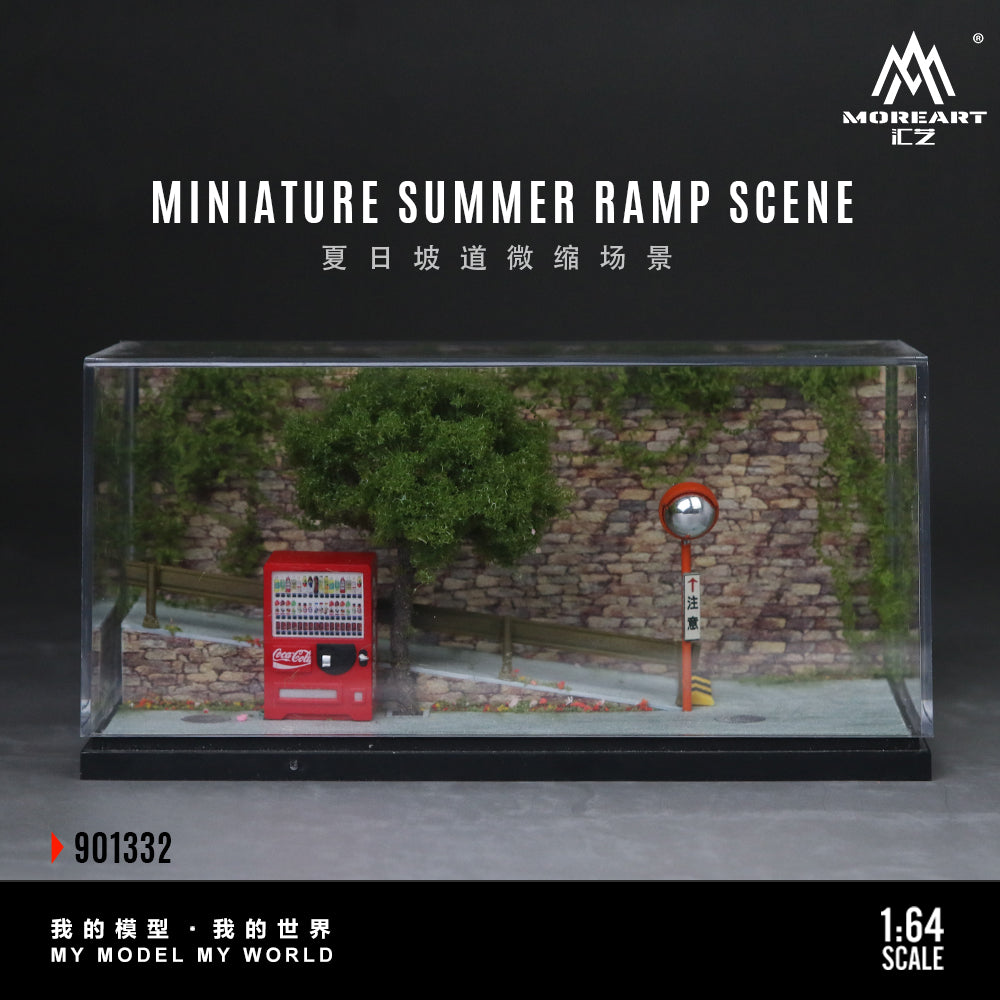 Miniature summer ramp scene model in a clear display case with a brick wall and red object.