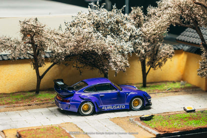 Blue car with 'EURUSATO' branding parked under cherry blossom trees.