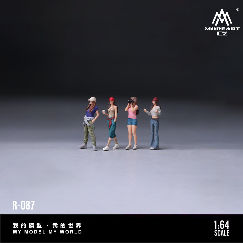 Four miniature figures standing on a gray surface with a dark background, featuring the brand 'MOREART'.