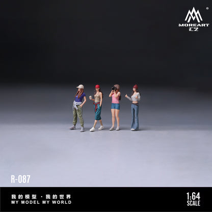 Four miniature figures standing on a gray surface with a dark background, featuring the brand 'MOREART'.
