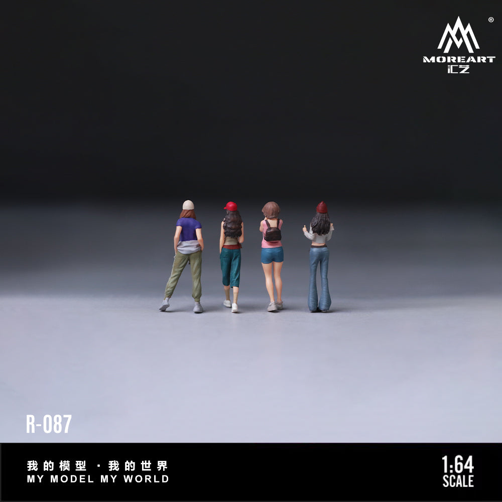 Four miniature figures standing in a line on a gray surface with 'MOREART' branding.