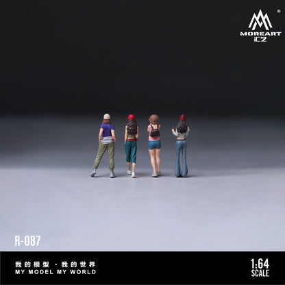 Four miniature figures standing in a line on a gray surface with 'MOREART' branding.