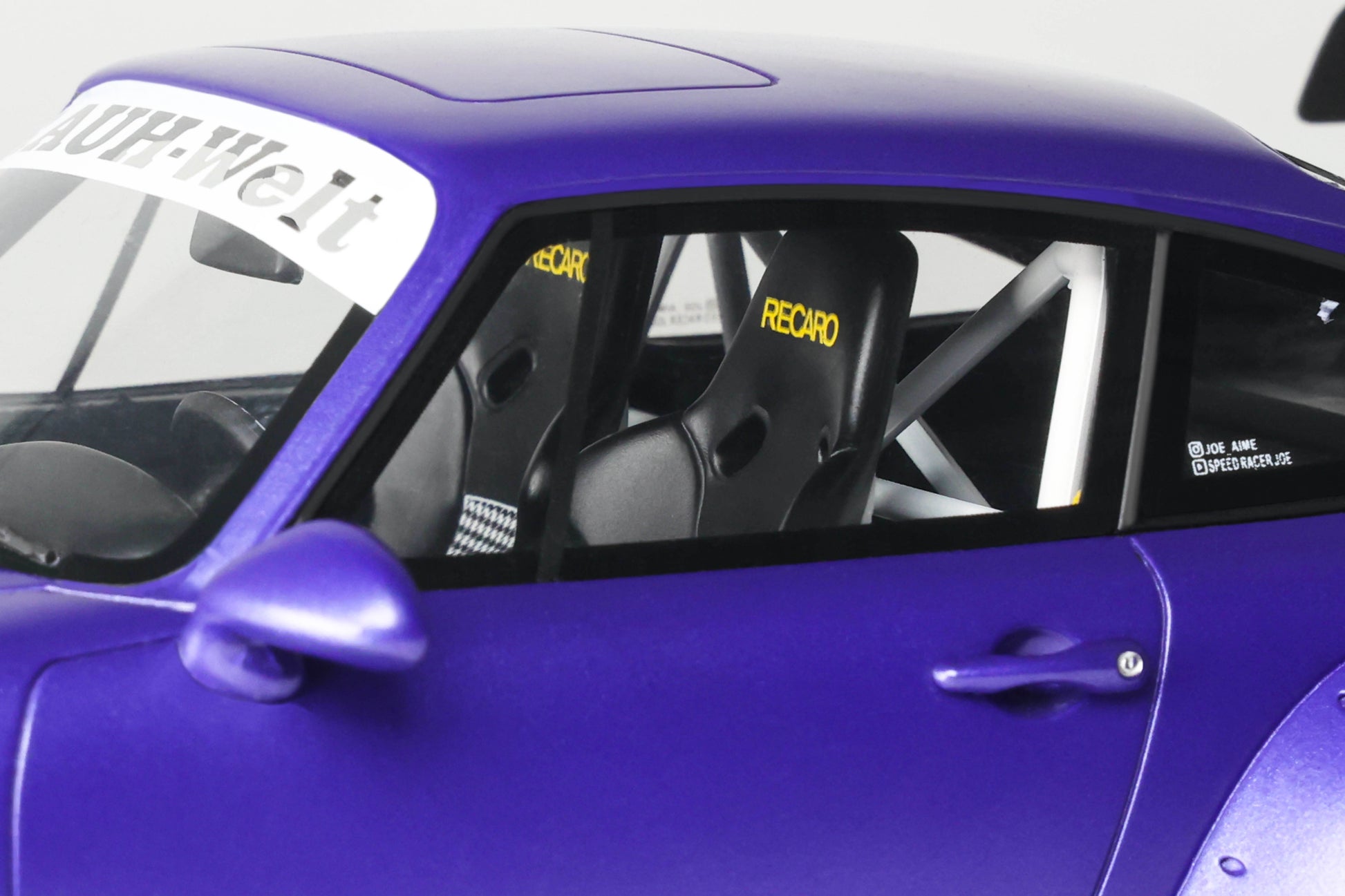 Close-up of a purple car interior with 'Record' branding on the seats.