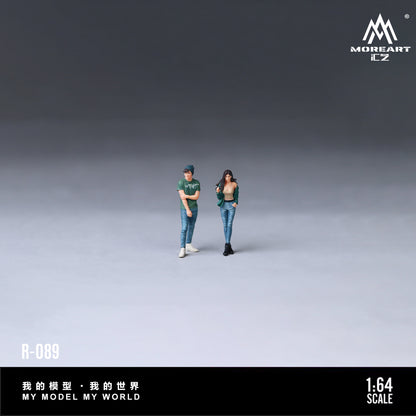 Two action figures of a couple standing with 'MoreArt' branding.