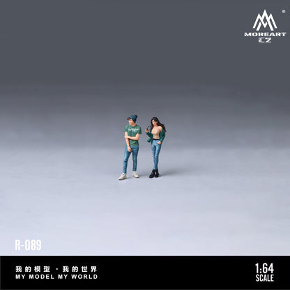 Two action figures of a couple standing with 'MoreArt' branding.