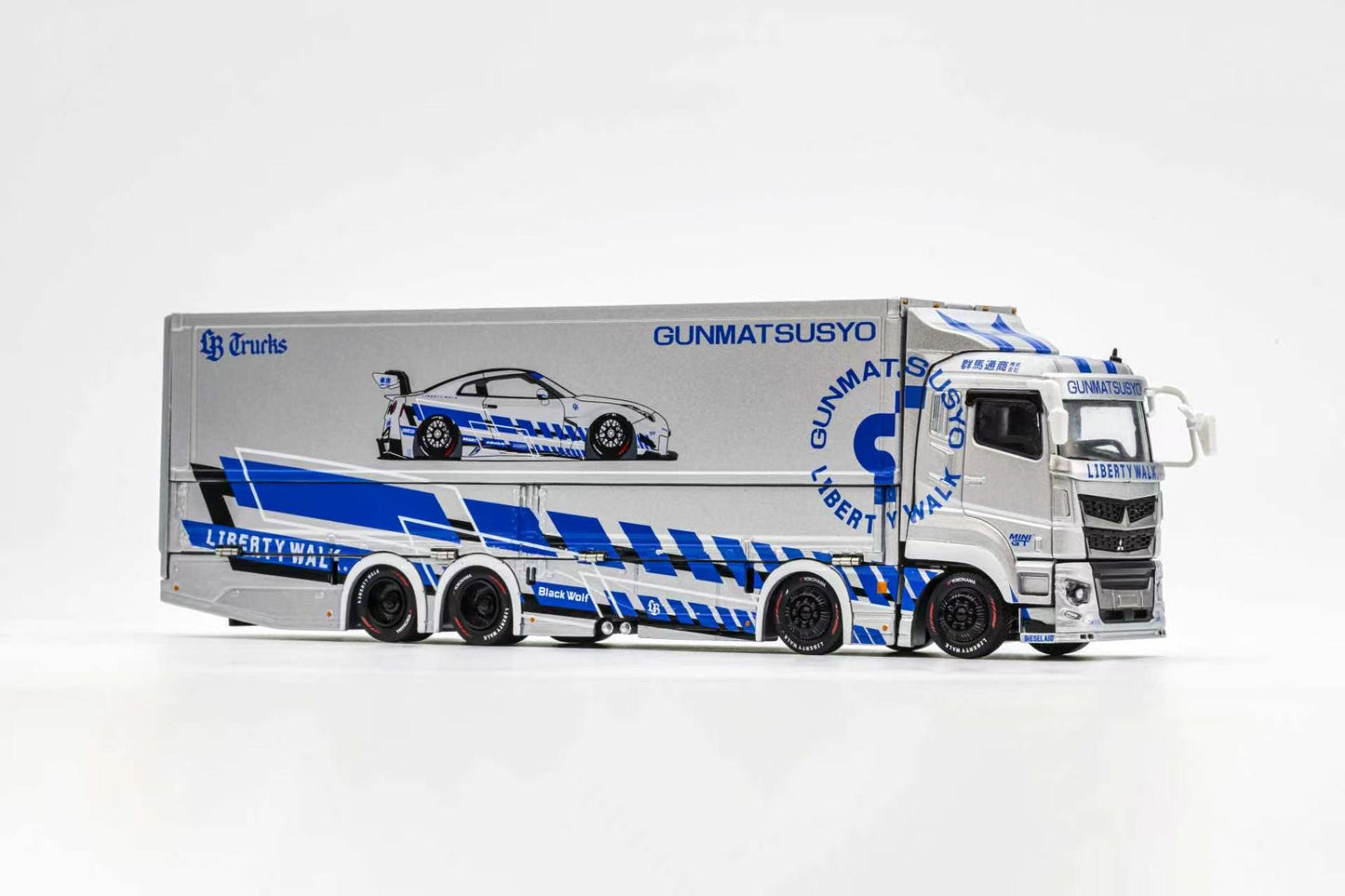 Model truck with trailer featuring branding on a white background