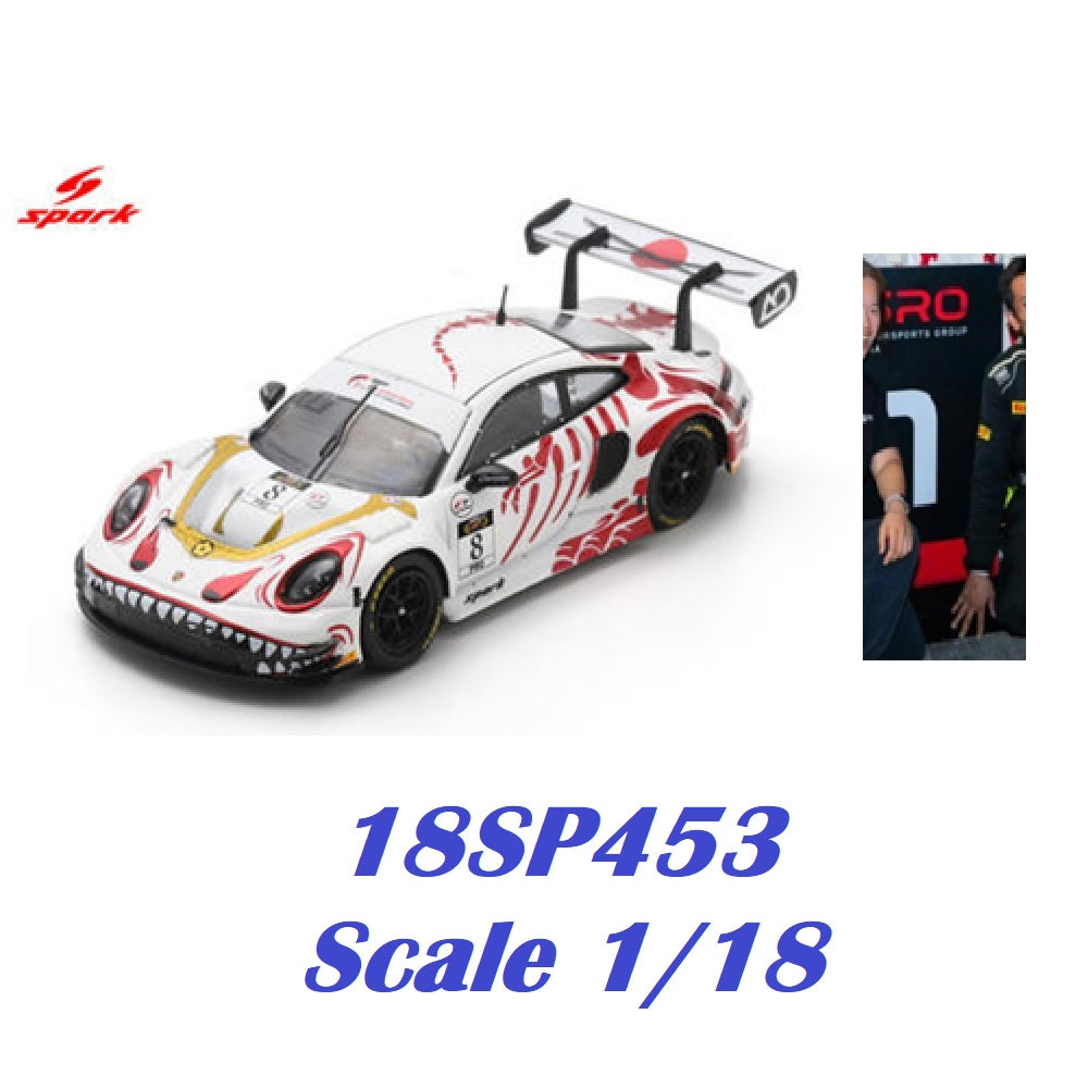 Spark brand 1/18 scale model car, model number 18SP453, featuring a white Porsche 911 GT3 race car with red, black, and gold livery and a shark-face graphic on the front bumper. The image includes a small inset photo of a driver in a team uniform on the right, and blue text at the bottom reading '18SP453 Scale 1/18'.