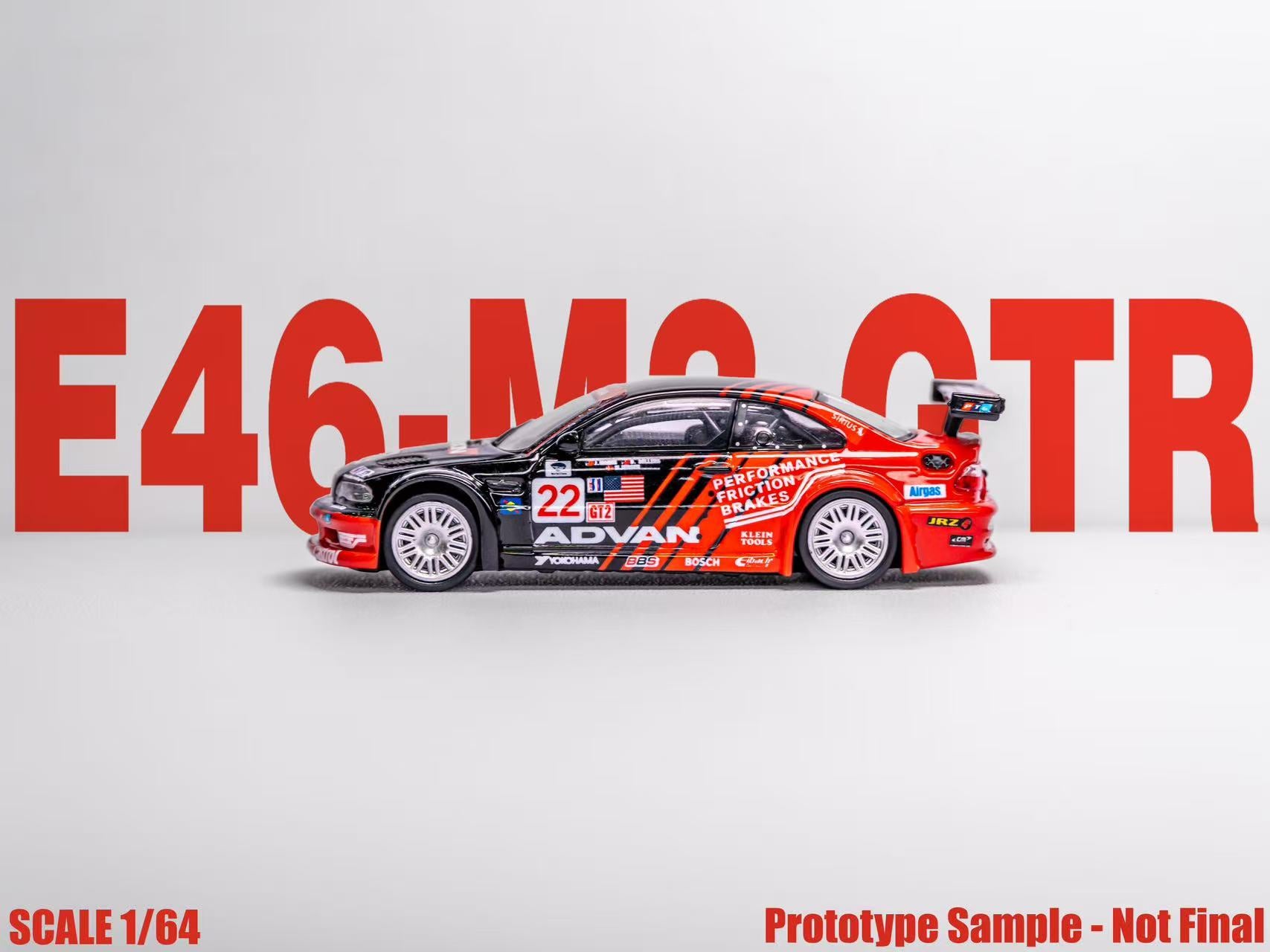 Model car of E46-M3 GTR with visible branding on a gray background