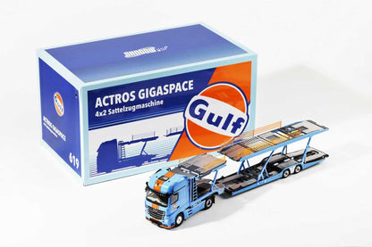 Model truck with trailer and Gulf oil branding next to its packaging box.