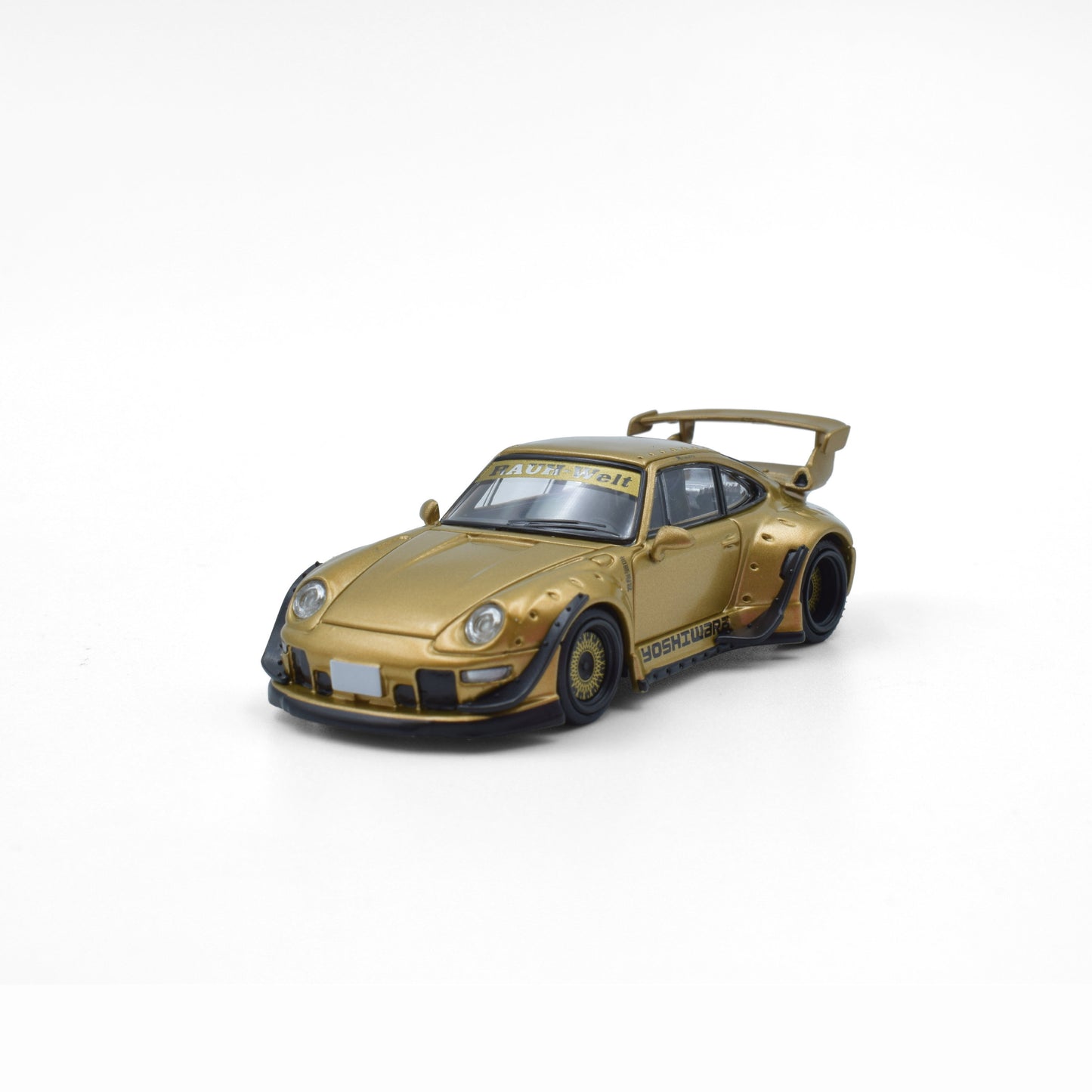 Gold sports car model on a white background