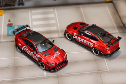 Two red model cars with brand logos on a tiled floor.