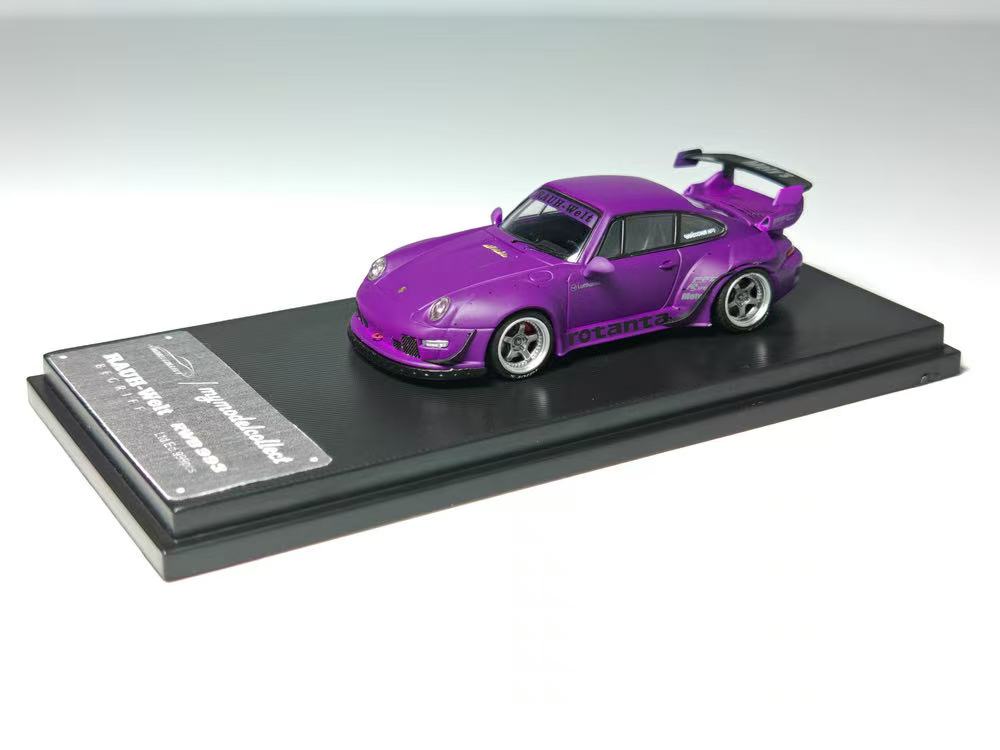 Purple model car on a black display stand with a white background