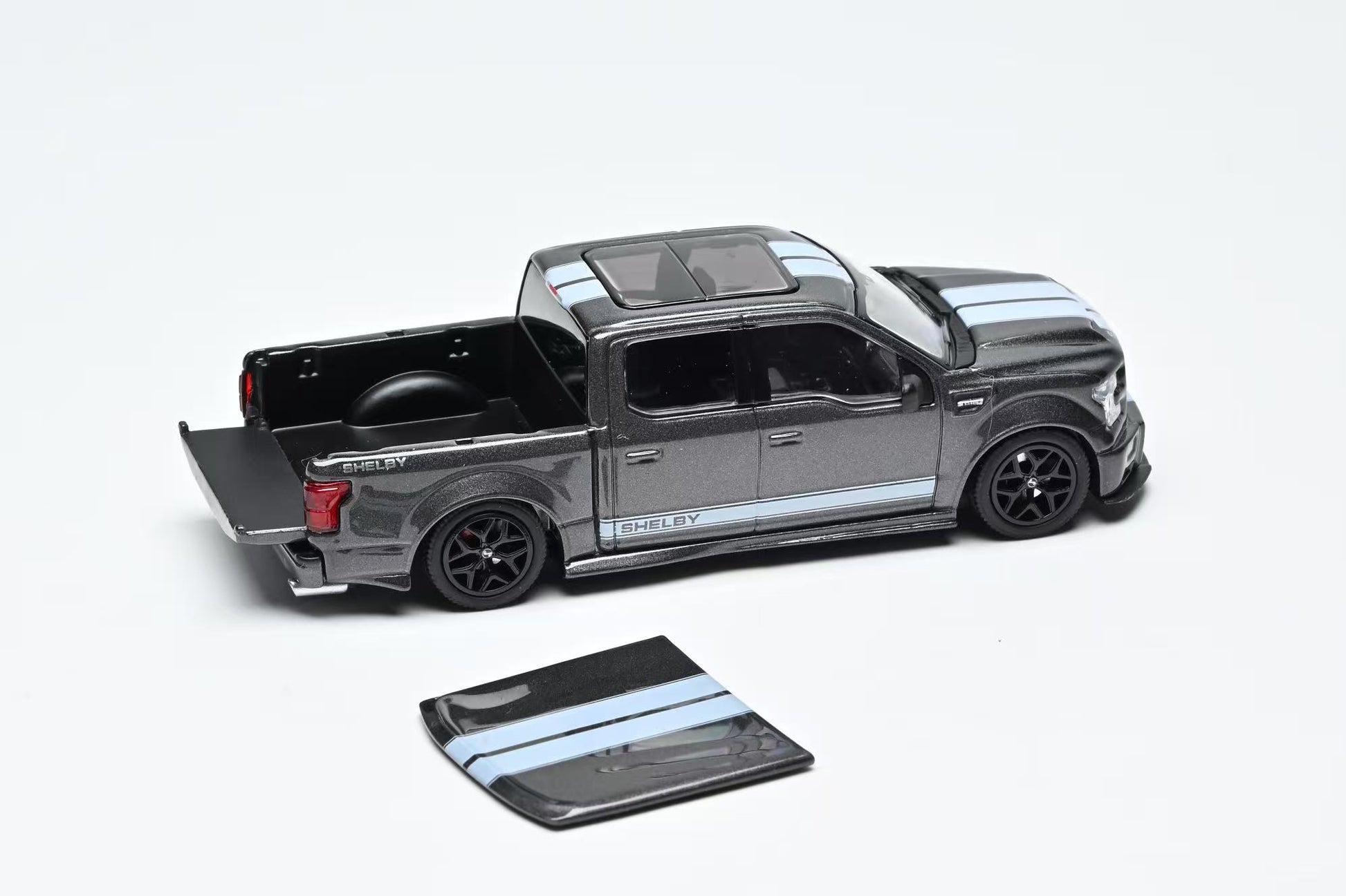 Model truck with an open bed on a white background