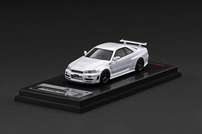 Model car on a black display stand against a dark background