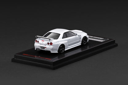 Model car on a black display stand against a dark background