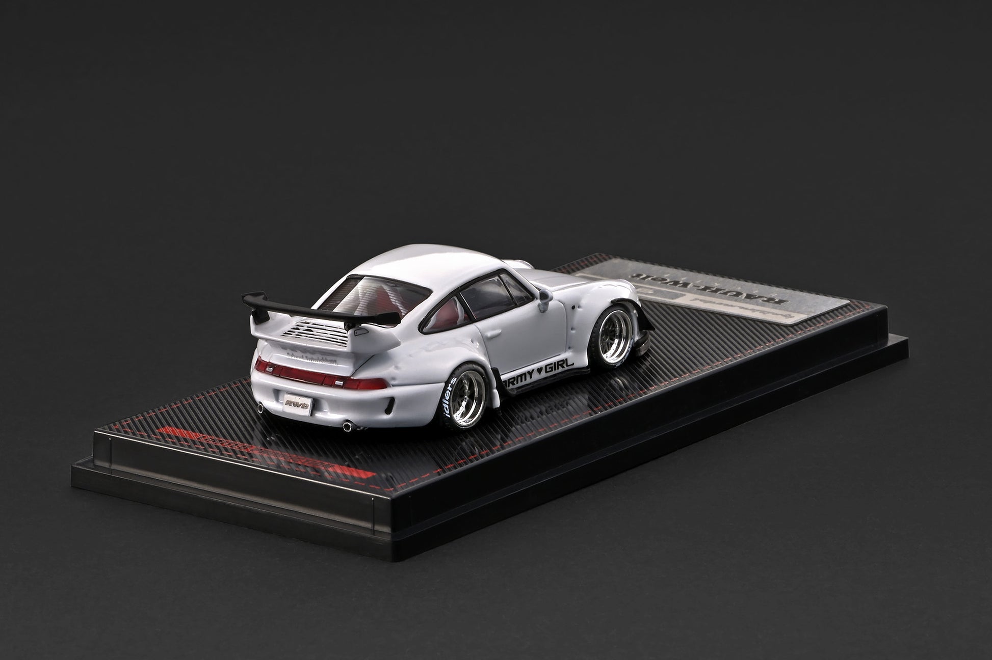 Model car on a display stand with a dark background