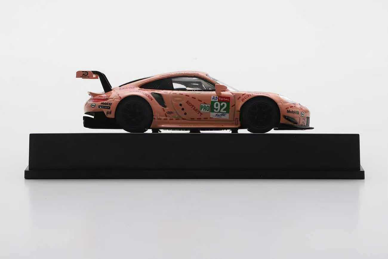 Model of a pink racing car on a white background
