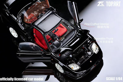 Black car model with open hood on a reflective surface, featuring Topart branding.