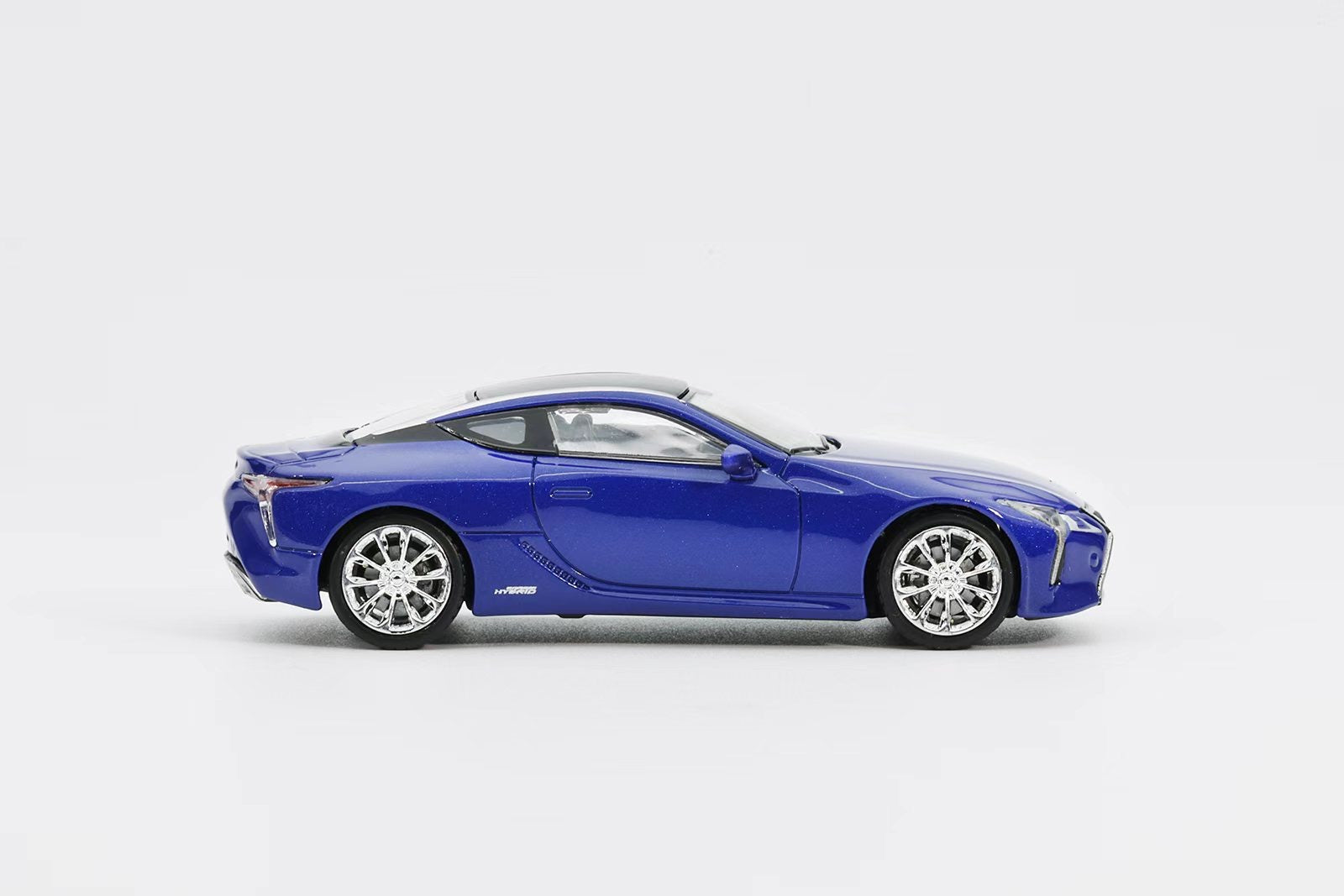 Blue sports car on a white background