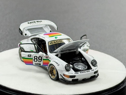 Model car with rainbow livery and visible branding on a gray background