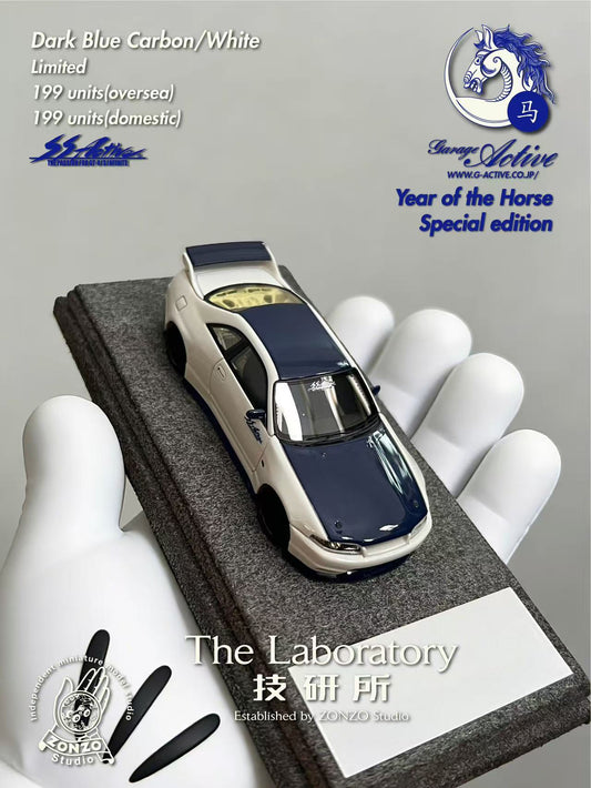 Model car on display stand with 'The Laboratory' branding and text about limited edition model.