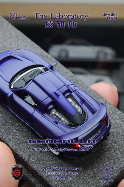 Model car of a Gumball car on a gray surface with 'The Laboratory' branding.