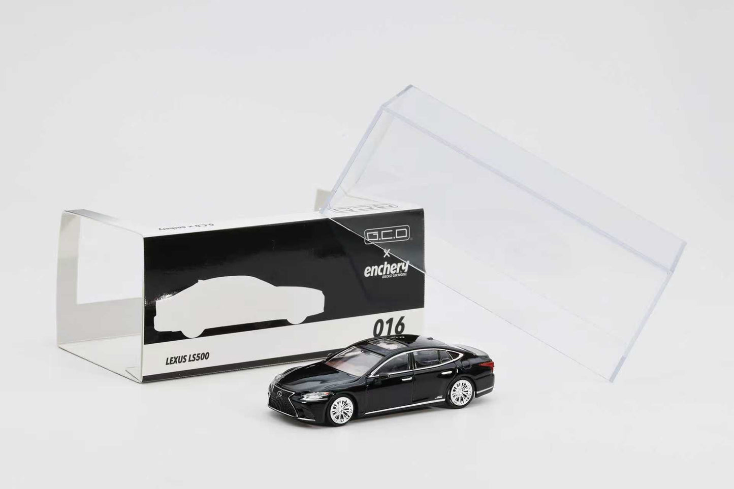 Black Lexus LS500 model car with packaging on a white background