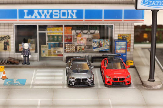 Model cars in front of a Lawson convenience store