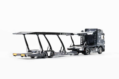 Model of a truck with a car carrier on a white background