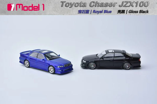 Two toy model cars, one blue and one black, on a light gray background with Toyota Chaser JZX100 branding.