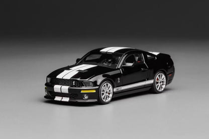Black and white model car on a gray background