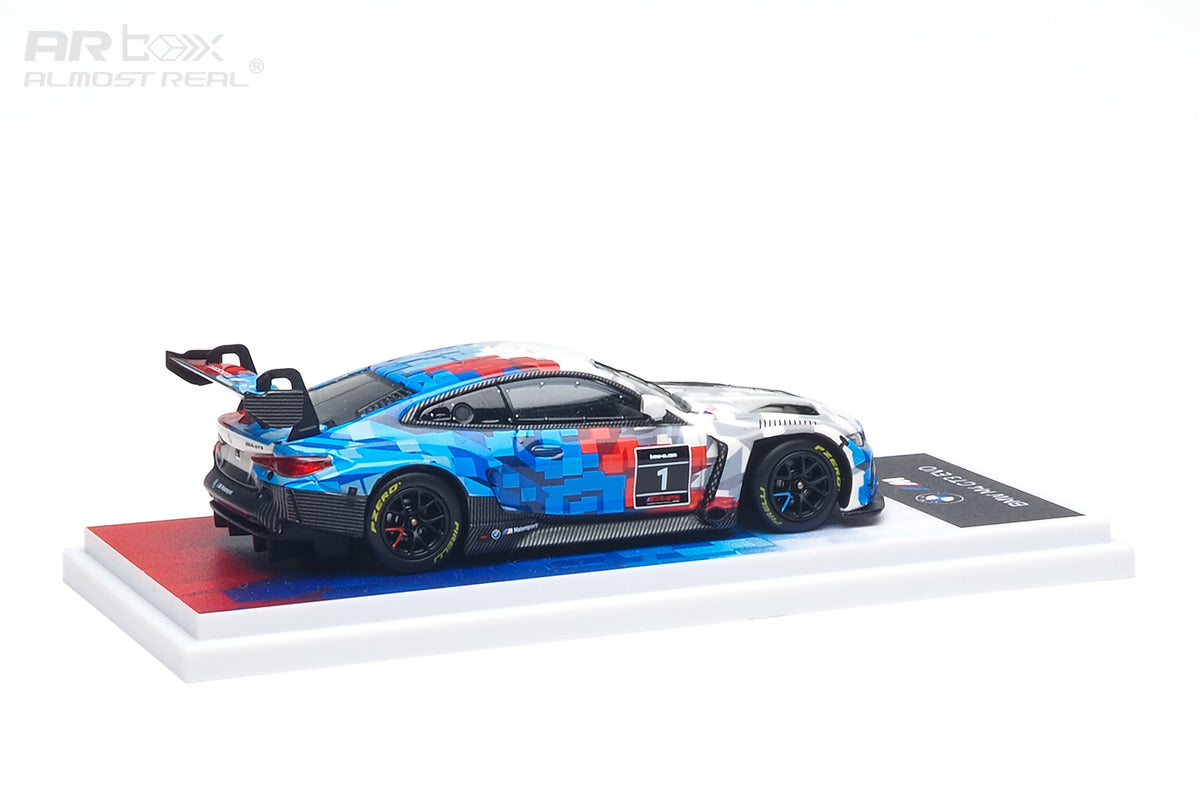 AR Box 1:64 BMW M4 GT3 EVO #1 BMW M Motorsport Racing Livery Diecast Model Car Side View with Blue Red White Camouflage Graphics, Black Racing Wheels, Pirelli Tires, Large Rear Wing and Display Base
