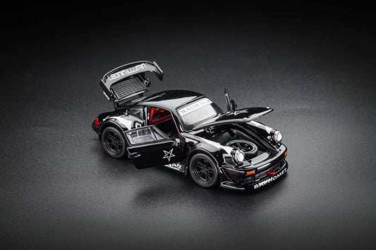 A black die-cast model car with its doors and trunk open, displayed on a dark gray studio background. The car features white text decals, including 'MUTUAL' on the trunk lid and 'DISCIPLINED' on the front bumper, along with a white star graphic on the side.