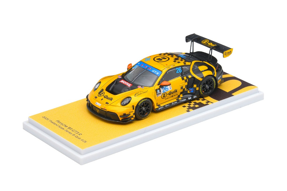 Yellow and black Porsche 911 racing car model on a white platform with a white background