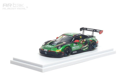 Model car on a white platform with a white background