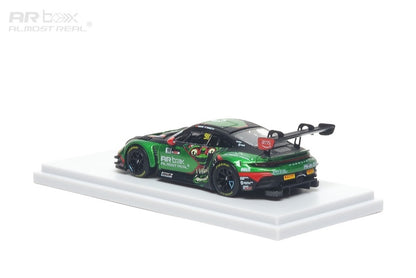 Model car on a white platform with a white background